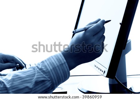 businessman hand holding pen and pointing to the computer,toned blue.