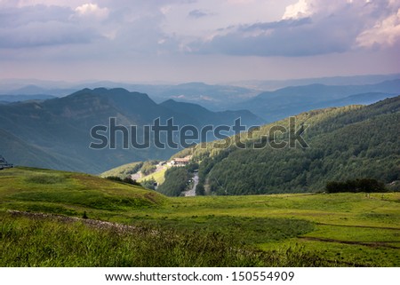 Mountain landscape with purple sky after the storm