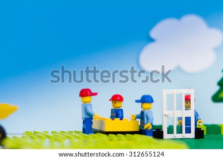 Orvieto, Italy - August 29th 2015: Construction site of Lego, Team of workmen build a house in a sunny day. Lego is a popular line of construction toys manufactured by the Lego Group
