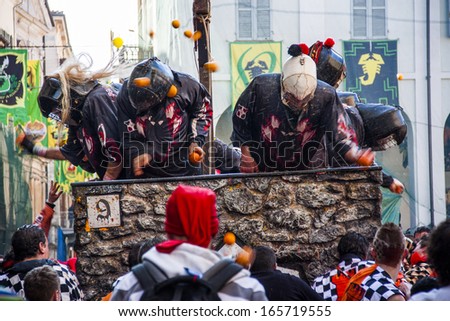 IVREA, ITALY-MARCH 6, 2011 : Historic Carnival of Ivrea. Battle of 9 teams \