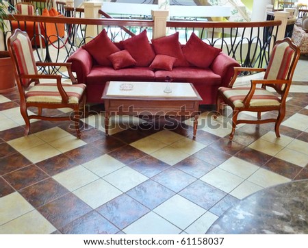 Sofa with chairs in a big hall of a hotel