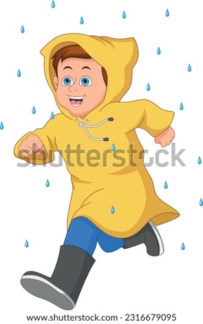 cute boy running wearing raincoat and boots in the rain