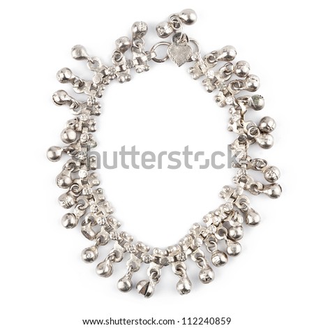 Old white metal bracelet isolated on white
