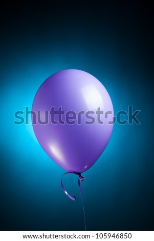 festive purple balloon on blue