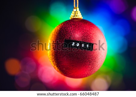 Christmas ball with 2011 title and multicolor background