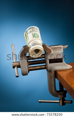 low budget concept - money in the vice tool