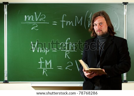 math teacher against the blackboard