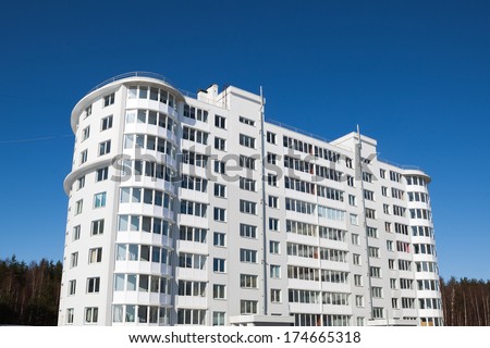 generic apartment house on blue sky background