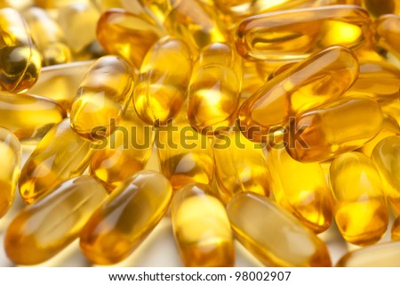 omega-3 fish fat oil capsules background