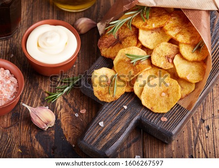 Similar – Image, Stock Photo Potato chips and sauce on the table, close up