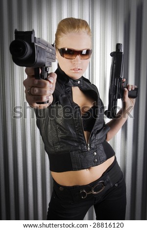 pretty female secret agent holding guns