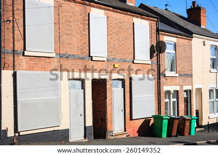 SNEINTON, NOTTINGHAM, ENGLAND - OCTOBER 17: Boarded up terrace houses in a fairly deprived area of urban Nottingham, on Finsbury Avenue, Sneinton, Nottingham. On 17th October 2010.