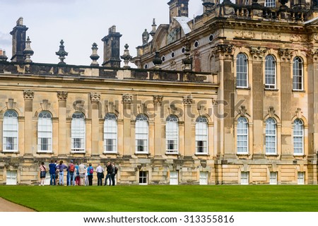 CASTLE HOWARD, YORK - AUGUST 22: A group of tourists on a guided tour. Castle Howard, York, England. On 22nd August 2015.