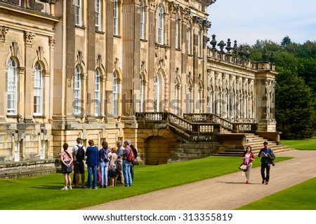 CASTLE HOWARD, YORK - AUGUST 22: A group of tourists on a guided tour. Castle Howard, York, England. On 22nd August 2015.
