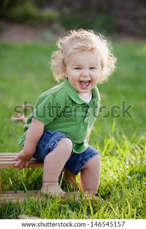 Young Boy Sitting on a Stool