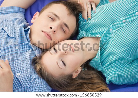 Beautiful couple lay on the ground