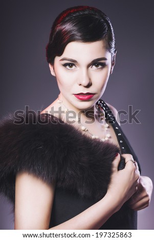 Beautiful Brunette Retro Woman with red lips make up and wave bang hairstyle