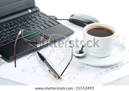 Pen, chart, notebook, eyeglasses and cup of coffee. Business still-life.