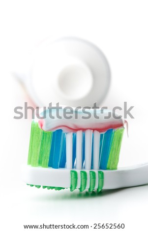 Tooth-brush and tooth-paste on a white background