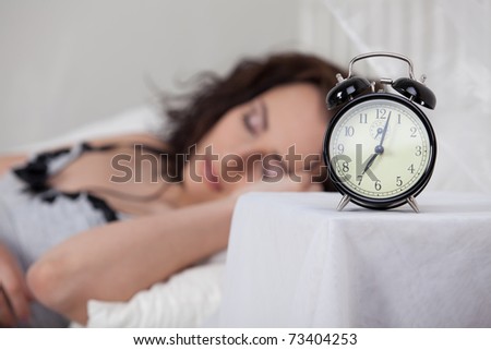Portrait of beautiful young woman sleeping in bed at home.