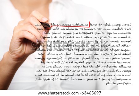 A picture of a female hand which underlines something in a composition