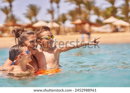 Similar – Image, Stock Photo Mother and son diving on a swimming pool