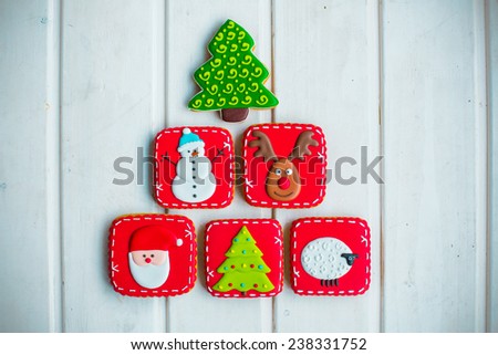 christmas tree form cookies on white texture background