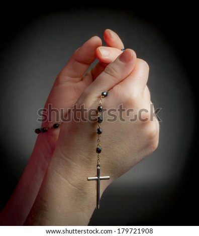 Praying Hands Holding Rosary Beads On Black Background Stock Photo ...