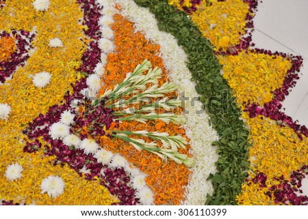 Hand made rangoli design of flower petals on Independence day of India