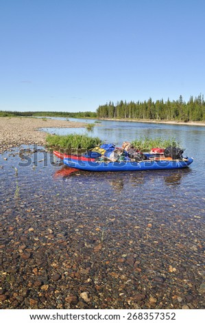 River Polar Urals on a Sunny summer day. Catamaran for rafting on the taiga river.