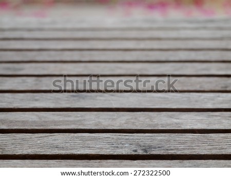 backdrop or background picture of old aged weathered cracked naked gray brown abandoned wood profile surface texture close up outdoor