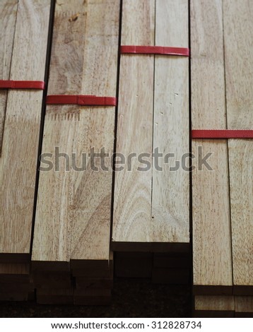 stack of industrial processed light yellow brown colour natural wood for furniture and construction work