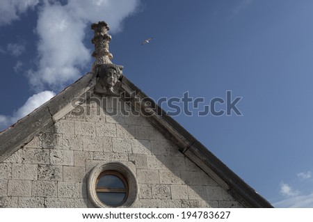 detail of church facade with architectural sculpture