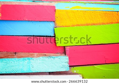 Wooded wall was painted to be colorful wall such green, pink and yellow. It will be beautiful background for you.