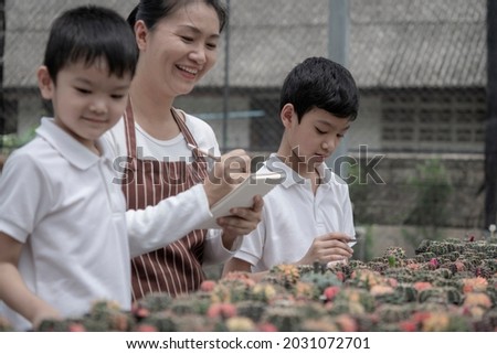 Similar – Image, Stock Photo Boy planting cactus seedling in garden