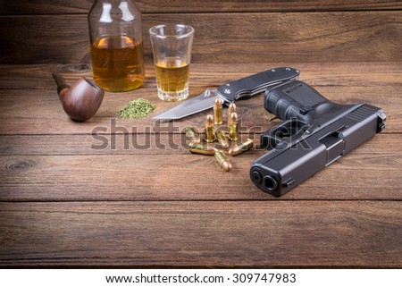 Gun with bullets on the wooden floor