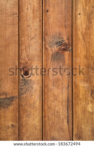 Old, weathered patio table surface texture, made of White Pine stained and varnished knotted planks, with joint grooves.