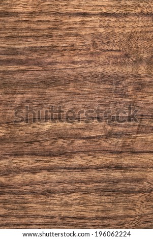 Walnut hardwood texture sample, with featured fine surface grain and annual growth lines.