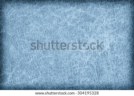 Photograph of old Blue animal skin parchment, creased, coarse, vignette grunge texture sample.