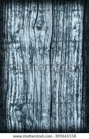 Old Weathered Rotten Cracked Square Timber Bollard, Bleached and Stained Blue, Vignette, Grunge Surface Texture Detail.