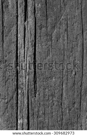 Old Weathered, Rotten, Cracked, Square Timber Bollard, Bleached and Stained Gray, Grunge Surface Texture Detail.