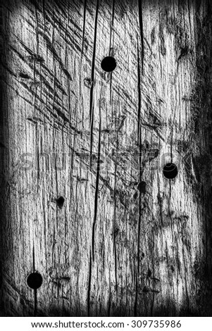 Old Weathered, Rotten, Cracked, Square Timber Bollard, Bleached and Stained Gray, Vignette Grunge Surface Texture Detail.