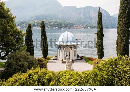 BELLAGIO MAY 14, 2014: Close up of a white romantic Italian wedding chapel with the lake and mountains in the background taken on May 14, 2014 in Bellagio, Italy