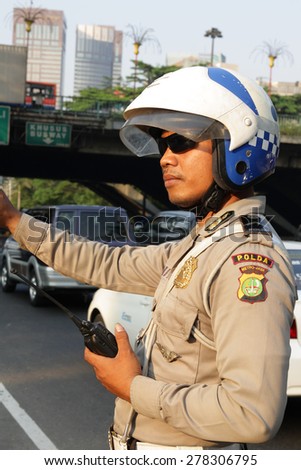 Jakarta, Indonesia. 07.20.2008. Rasuna Said st. Traffic officer.
