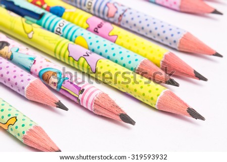 Close up of pencil sharpeners colorful row ends on white background