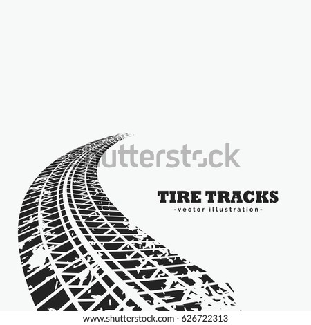 dirty tire tracks fading into the horizon