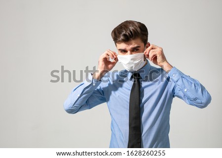 Similar – Image, Stock Photo Man with face mask and gloves looking out the window