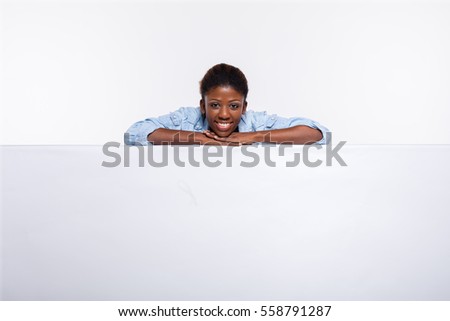 Similar – Image, Stock Photo Cheerful black woman leaning on railing in port