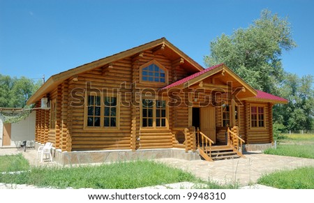 Porch of the big wooden house combined from logs.