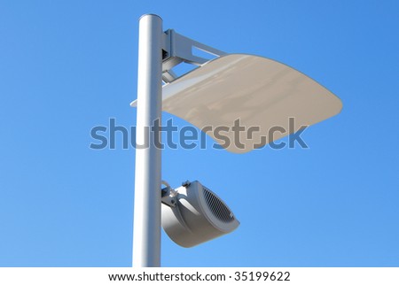 Modern lantern of street illumination against the blue sky